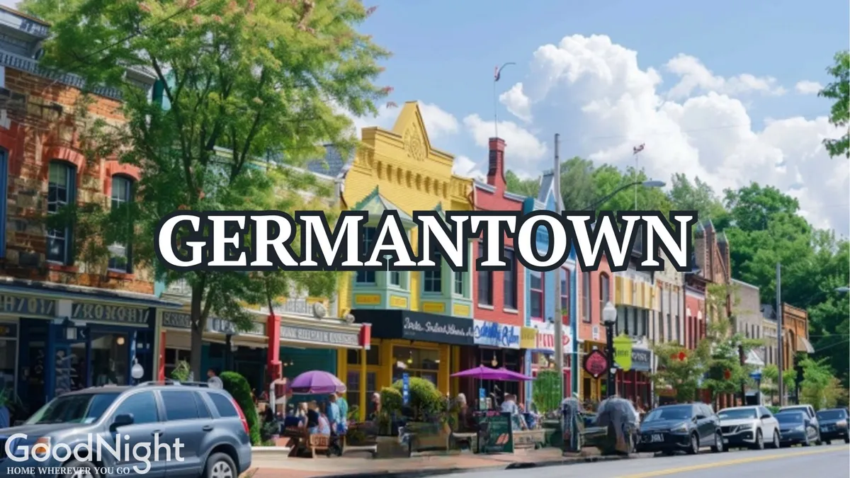 A bustling, tree-lined street featuring colorful storefronts and people enjoying outdoor dining. The scene is inviting and vibrant, suggesting a lively urban neighborhood with plenty to discover.